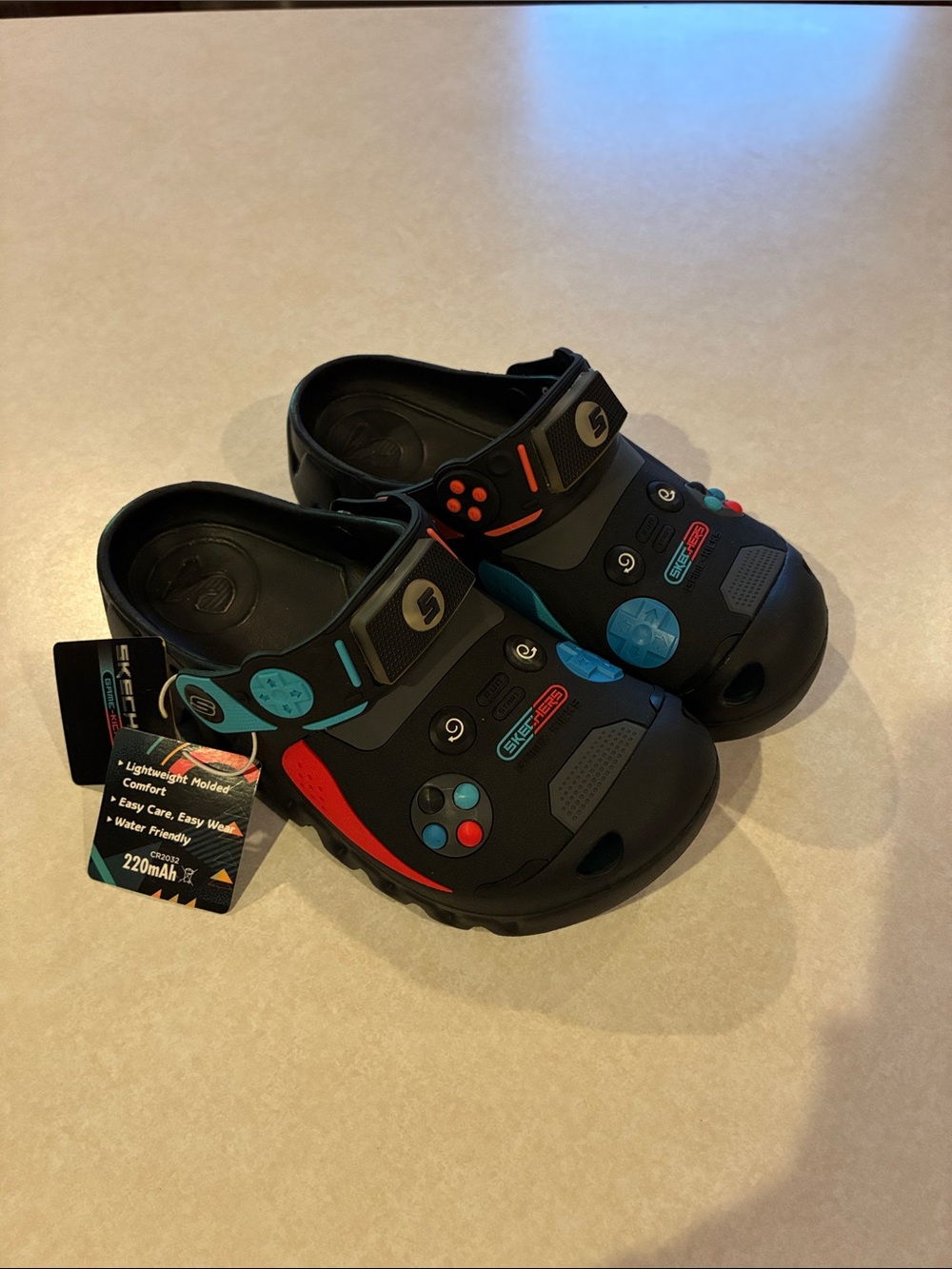 Skechers Black Clog Sandals with Blue & Red Gammer Accents